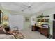 Bedroom with a ceiling fan, shelves, and a desk at 511 Governors Green Dr, Venice, FL 34293