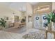 Bright and airy foyer with a view into the formal dining room, featuring beautiful tile floors at 511 Governors Green Dr, Venice, FL 34293