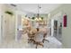 Large kitchen with eat-in area, light wood cabinets, and lots of natural light at 511 Governors Green Dr, Venice, FL 34293