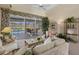 Bright living room with sliding glass doors that lead to the pool area, creating seamless indoor-outdoor living at 511 Governors Green Dr, Venice, FL 34293