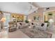 Spacious living room with comfortable seating and views of the landscaped outdoors at 511 Governors Green Dr, Venice, FL 34293