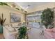 Comfortable living room with large windows overlooking the pool and outdoor living area at 511 Governors Green Dr, Venice, FL 34293