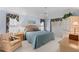 Cozy main bedroom with a ceiling fan, natural light, and a comfortable seating area at 511 Governors Green Dr, Venice, FL 34293