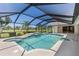 Inviting screened-in pool and spa area with views of the lush green golf course at 511 Governors Green Dr, Venice, FL 34293