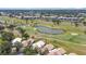 Aerial shot of property shows golf course views, community buildings, and the home's prime location at 542 Clubside Cir # 20, Venice, FL 34293