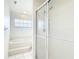 Bright and clean bathroom with a glass-enclosed shower and a separate tub at 542 Clubside Cir # 20, Venice, FL 34293
