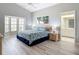 Sun-filled bedroom with ensuite bathroom and large bay window offering plenty of natural light at 542 Clubside Cir # 20, Venice, FL 34293