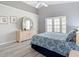 Bedroom with bay window, vaulted ceiling, and light wood floors with neutral paint colors at 542 Clubside Cir # 20, Venice, FL 34293