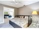 Cozy guest bedroom featuring daybed with trundle and side table, adjacent to the bright living room at 542 Clubside Cir # 20, Venice, FL 34293