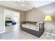 Cozy guest bedroom with a daybed and trundle, next to the bright and airy living room at 542 Clubside Cir # 20, Venice, FL 34293