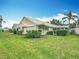 Charming home with lush landscaping and a well-maintained lawn at 542 Clubside Cir # 20, Venice, FL 34293