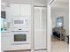 Modern kitchen appliances and pantry storage at 542 Clubside Cir # 20, Venice, FL 34293