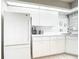 All-white kitchen with modern appliances at 542 Clubside Cir # 20, Venice, FL 34293