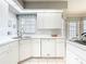 Bright and clean kitchen with modern appliances and ample counter space at 542 Clubside Cir # 20, Venice, FL 34293