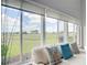 Bright living room featuring a large window with picturesque views of the golf course at 542 Clubside Cir # 20, Venice, FL 34293