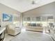 Bright living room with vaulted ceilings and large windows offering golf course views at 542 Clubside Cir # 20, Venice, FL 34293