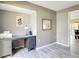 Well-lit office with a neutral color palette and a desk area, located adjacent to the main living area at 542 Clubside Cir # 20, Venice, FL 34293