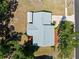 An aerial view showcases the home's roof, surrounding yard, and proximity to neighboring properties at 5457 Talbrook Rd, North Port, FL 34287