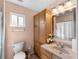 Bathroom featuring vanity with granite countertop and ample storage at 5457 Talbrook Rd, North Port, FL 34287