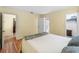 Cozy bedroom with wood floors and access to bathroom and closet at 5457 Talbrook Rd, North Port, FL 34287