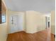 Bright entryway featuring hardwood floors and a view into other rooms, creating a welcoming ambiance at 5457 Talbrook Rd, North Port, FL 34287