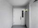 A well-lit, welcoming front door with sidelight enhancing the entrance's appeal at 5457 Talbrook Rd, North Port, FL 34287