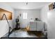 Bright laundry room features washer, dryer, water heater, and concrete floor, providing functionality and utility at 5457 Talbrook Rd, North Port, FL 34287