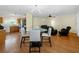 Open concept living space with wood floors and modern dining area at 5457 Talbrook Rd, North Port, FL 34287