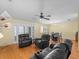 Open-concept living and dining area with hardwood floors, creating an inviting and spacious atmosphere at 5457 Talbrook Rd, North Port, FL 34287