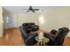 Inviting living area with hardwood floors and comfortable seating, perfect for relaxation and socializing at 5457 Talbrook Rd, North Port, FL 34287