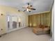 Sunroom with French doors, ceiling fan, carpet, and a lounge chair at 5457 Talbrook Rd, North Port, FL 34287