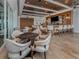 Stylish bar area featuring a sleek counter, comfortable seating, and a fully stocked bar at 553 Fallbrook Dr, Venice, FL 34292
