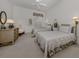 Cozy bedroom with two twin beds, ceiling fan, and classic decor at 553 Fallbrook Dr, Venice, FL 34292