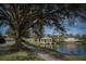 Scenic view of the Venice Golf and Country Club, with its beautiful lake and lush landscaping at 553 Fallbrook Dr, Venice, FL 34292