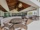 Spacious dining area with modern seating, elegant lighting, and large windows offering views at 553 Fallbrook Dr, Venice, FL 34292