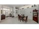 Open dining room with built-in shelving, decor, and a view of the entrance at 553 Fallbrook Dr, Venice, FL 34292