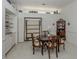 Dining room with a Murphy bed, light walls, and a dark wood dining table at 553 Fallbrook Dr, Venice, FL 34292