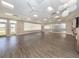 Bright fitness studio with hardwood floors, large windows, and ample space for activities at 553 Fallbrook Dr, Venice, FL 34292
