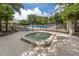 Relaxing hot tub surrounded by a lush landscape and a view of the swimming pool at 553 Fallbrook Dr, Venice, FL 34292