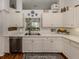 Bright and airy kitchen featuring white cabinets, stainless steel appliances, and counter space at 553 Fallbrook Dr, Venice, FL 34292