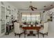 Bright living room features neutral tones, a ceiling fan, and furniture around a wood table at 553 Fallbrook Dr, Venice, FL 34292