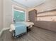 Relaxing treatment room with a massage table, storage cabinets, and a serene ambiance at 553 Fallbrook Dr, Venice, FL 34292