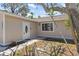 Inviting home entrance with a charming door and well-kept landscaping at 5992 Osprey Rd, Venice, FL 34293