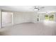 Open living area with modern flooring leading to a kitchen and outdoor space at 5992 Osprey Rd, Venice, FL 34293
