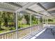 Covered patio with table, railing, and view of the backyard at 5992 Osprey Rd, Venice, FL 34293