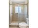 This bathroom features tile shower with glass doors and a shower head at 5992 Osprey Rd, Venice, FL 34293