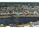 Waterfront homes showcase community, while this home has a standout blue roof, and its own dock on the water at 6422 Otis Rd, North Port, FL 34287