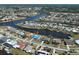 Waterfront neighborhood of houses including a blue roof home, offering canals for boating and recreation at 6422 Otis Rd, North Port, FL 34287