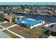Aerial view of the waterfront home featuring its lush landscaping and canal views at 6422 Otis Rd, North Port, FL 34287