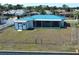 Home with screened lanai and shed, fenced yard and waterfront canal access at 6422 Otis Rd, North Port, FL 34287